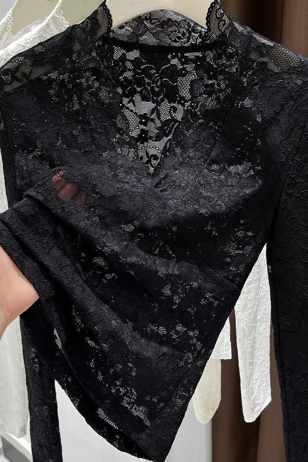 Black lace garment on a mannequin with a blurred background
